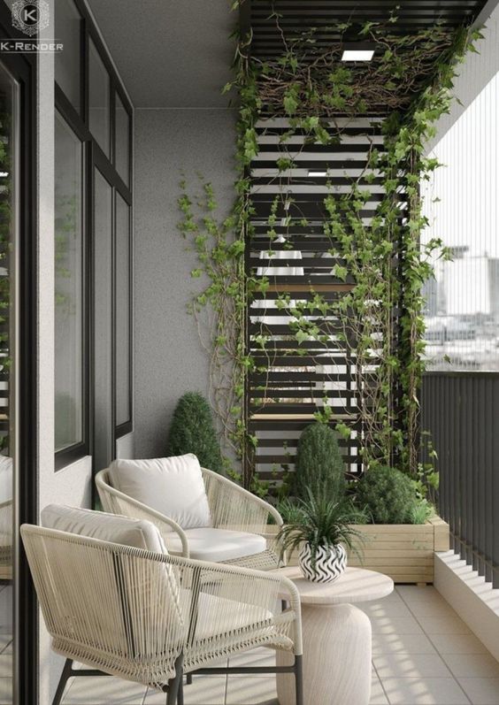 A stylish, modern balcony with neutral seating, a side table, potted plants and an arbor with climbing greenery is amazing