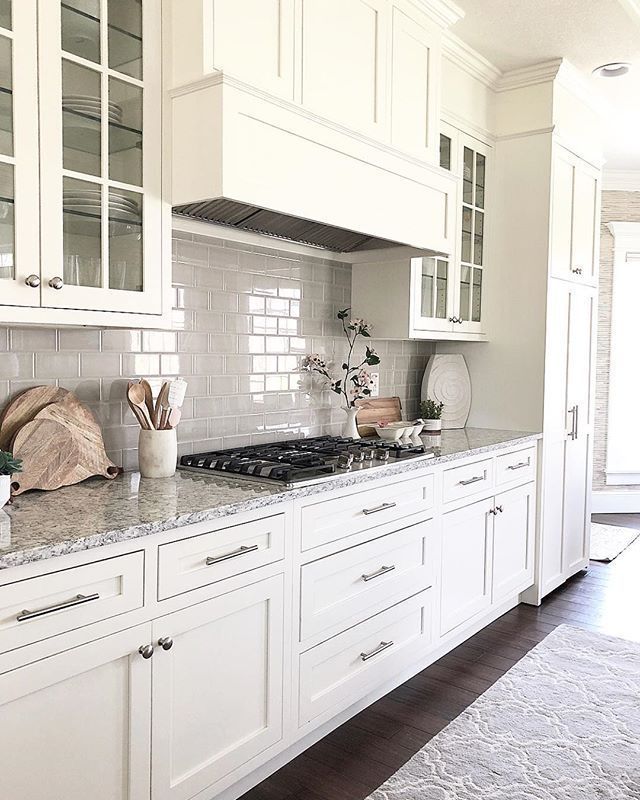 White cream kitchen cabinets, white subway tile backsplash, built .