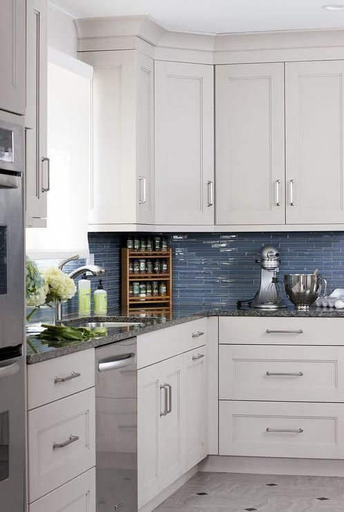 White Kitchen Cabinets with Blue Glass Tile Backsplash .