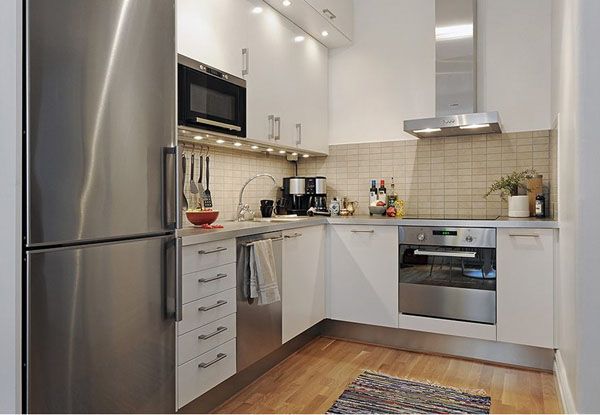 Small kitchen (like mine!). Love the wood floors, white cabinets .