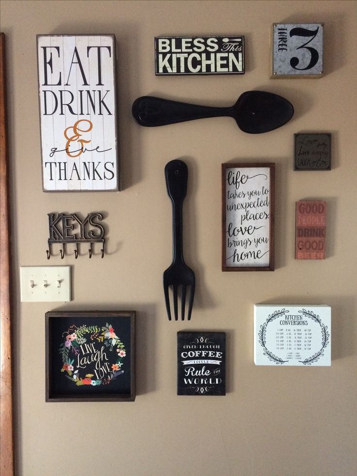 My kitchen gallery wall. All decor from hobby lobby and Ross .