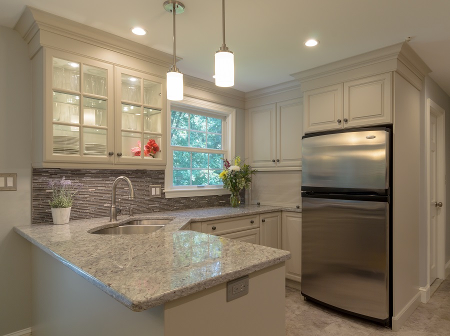 Off-White Kitchen Remodel with Improved Storage Space in Acton