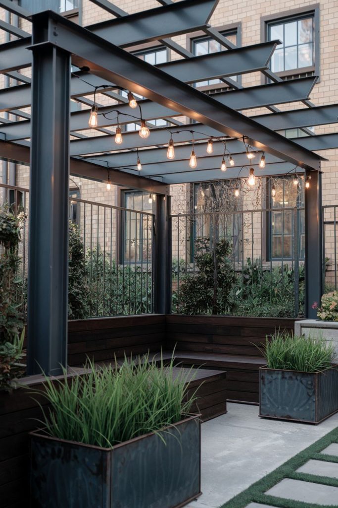 A modern pergola with fairy lights surrounded by benches and greenery on an outdoor patio.