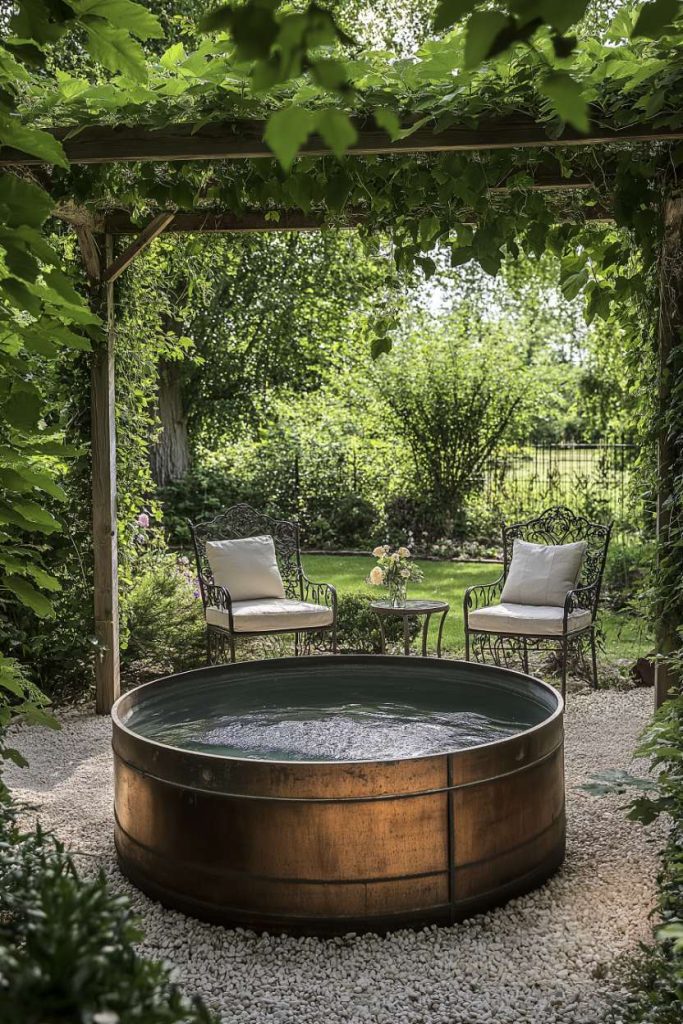 Garden with a round metal storage basin surrounded by greenery and wrought iron chairs.