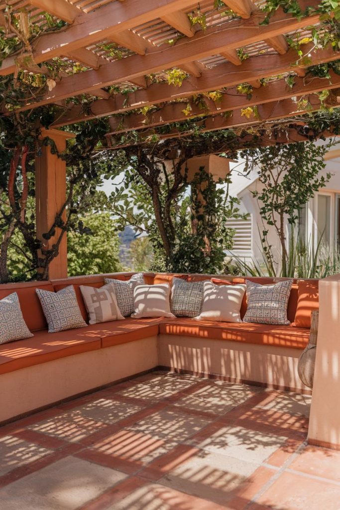 Outdoor seating area with terracotta cushions under a <a href=