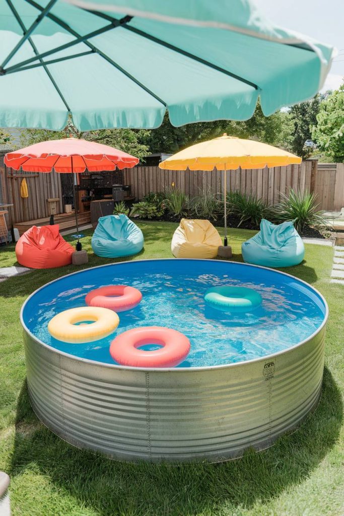 A backyard setting with a storage tank pool, colorful floats and surrounding bean bags under umbrellas.