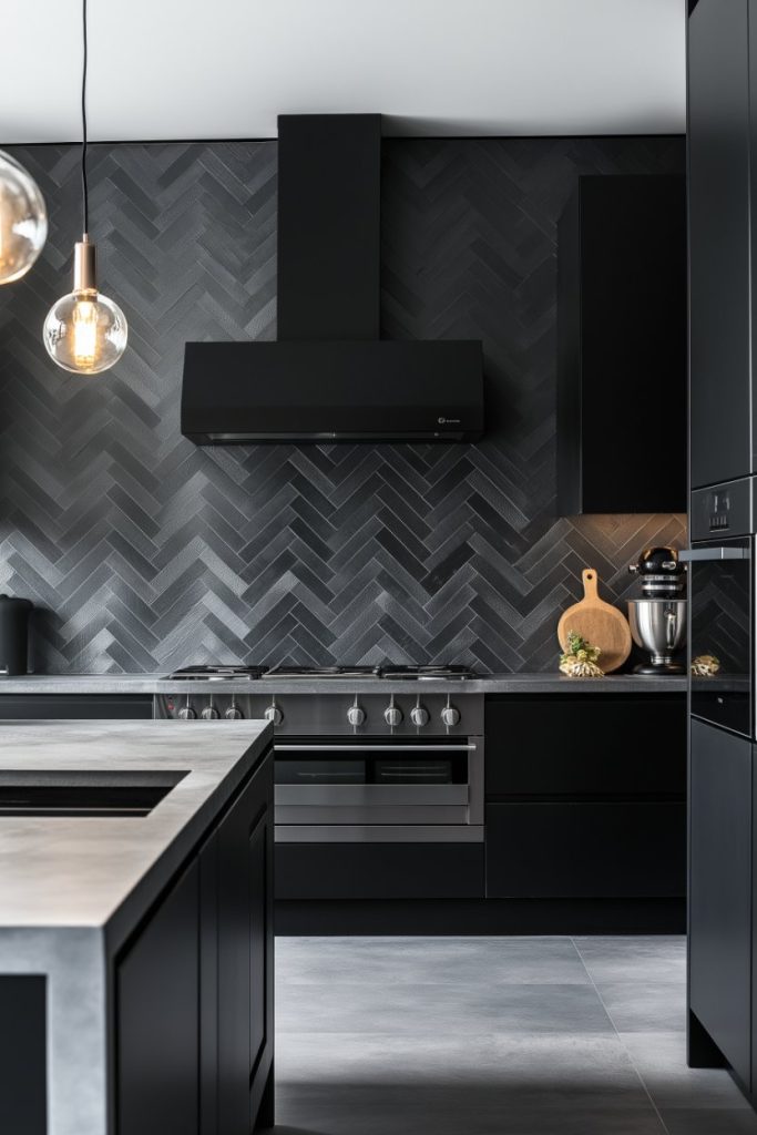 Modern kitchen with dark cabinets, herringbone tile backsplash, stainless steel stove, pendant light and kitchen appliances.