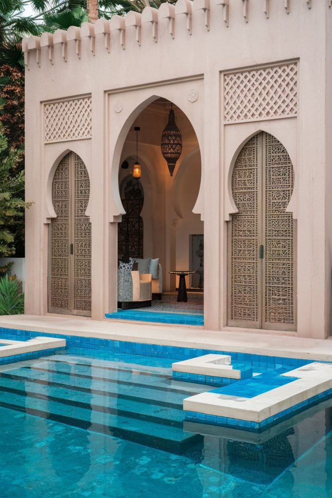 Moroccan-style buildings with ornate arches and wooden doors, next to a turquoise swimming pool. The interior features a couch and a hanging lantern.