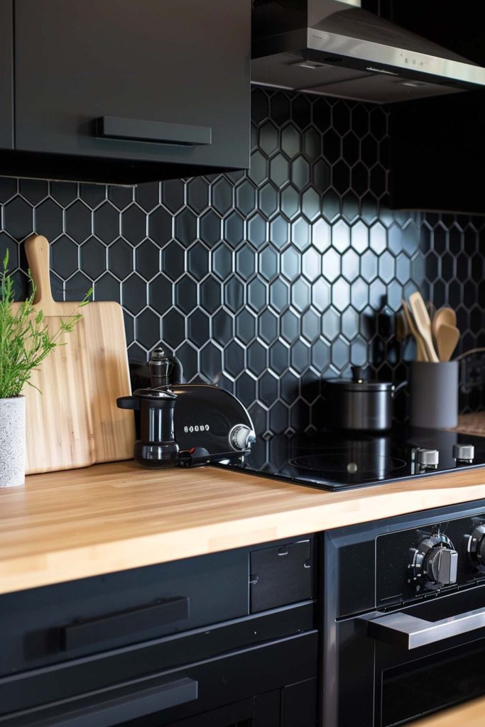 A kitchen presentation with a black hexagon tile backsplash and a light wood block worktop