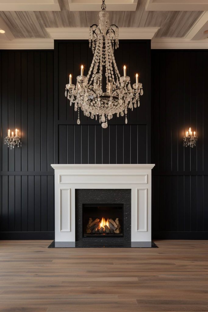 a living area with a black wall and a black fireplace lit by a majestic crystal chandelier above and matching crystal chandeliers on either side of the wall