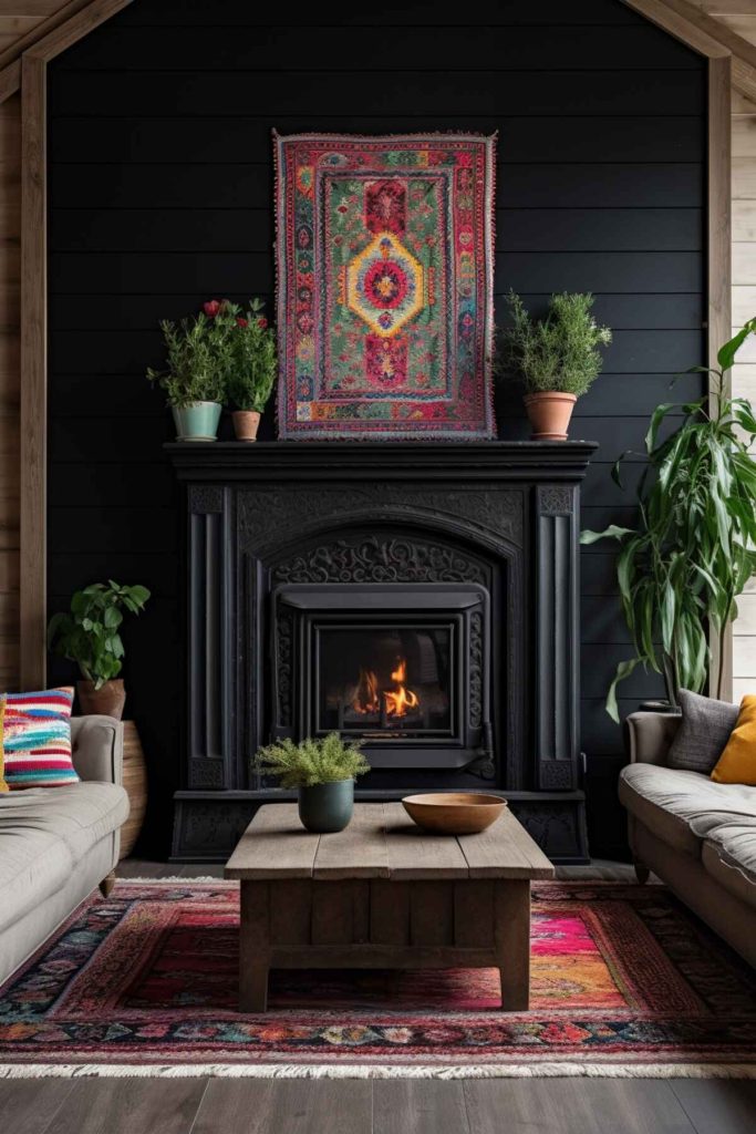 a living room with a black fireplace in front of a black border and a boho-style tapestry above