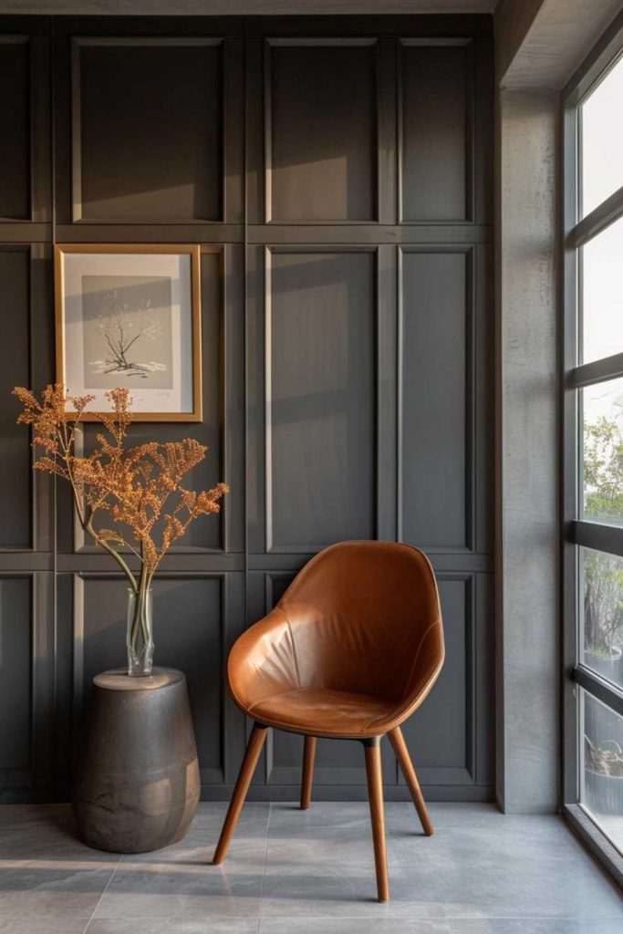 Yes, wainscoting can create an effortlessly cool vibe! The key is to use panels of different sizes and shapes to create a dynamic look, then choose a dark, cool tone like slate gray for that much-needed accent. 