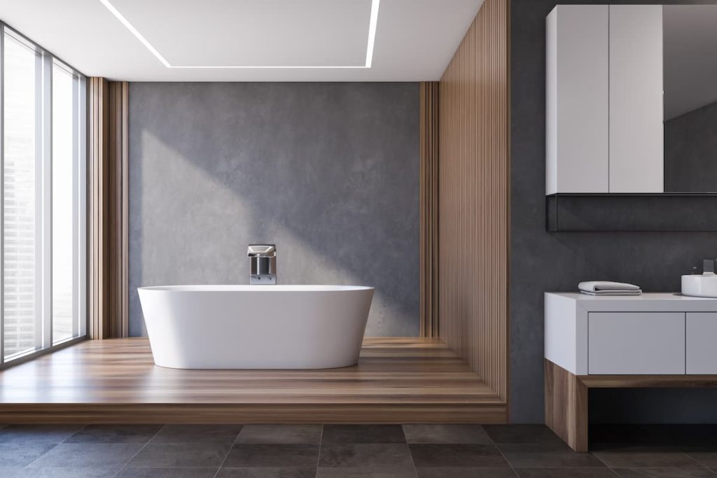 Modern bathroom in gray and wood, bathtub and sink