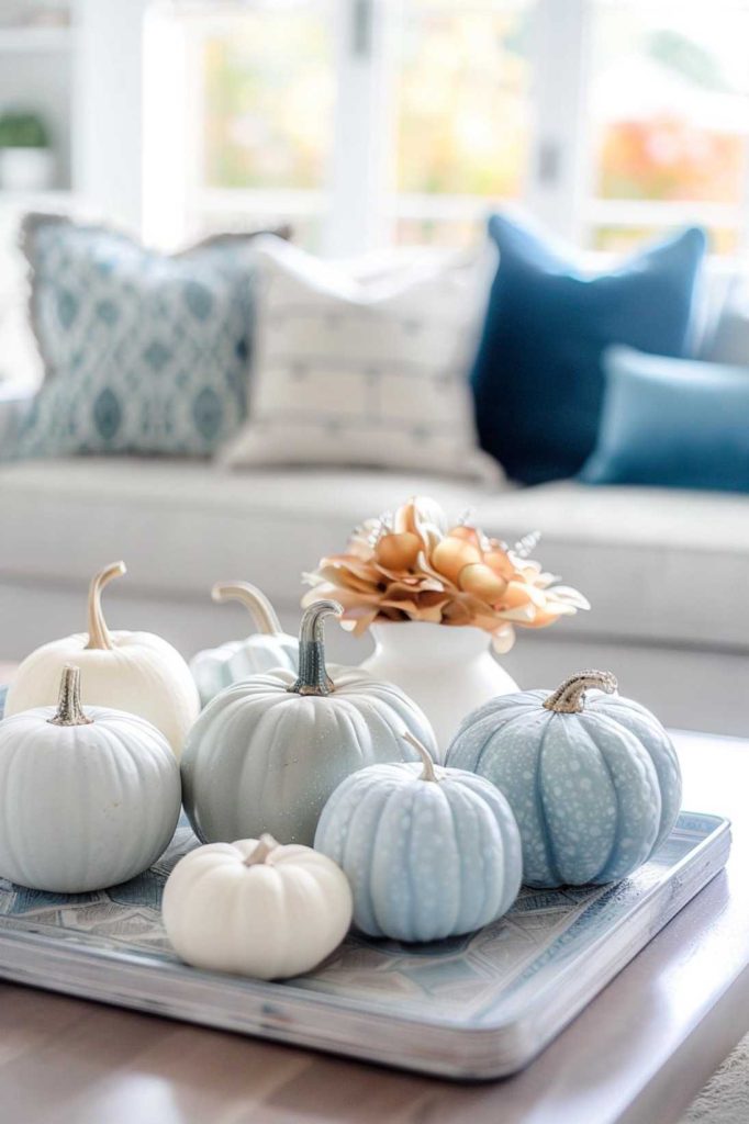 A playful selection of miniature pumpkins, each painted in a variety of pastel hues, offers a modern twist on the classic fall pumpkin theme.