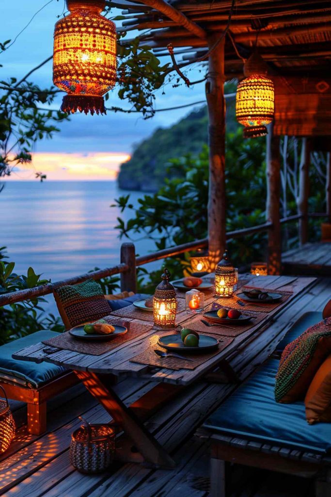 Outdoor table setting with colorful cushions surrounding a low rattan table, topped with mosaic lanterns and pretty bohemian textiles