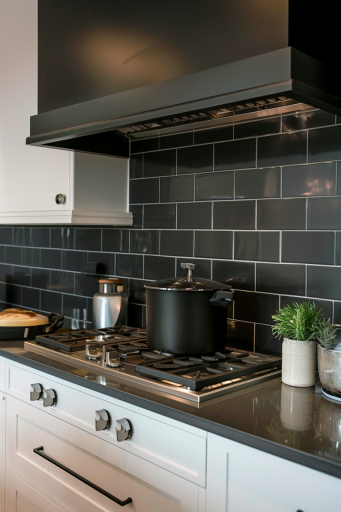 Smooth, black matte subway tiles provide a minimalist feel and contrast starkly with crisp white grout to create a modern take on the country-style kitchen backsplash.