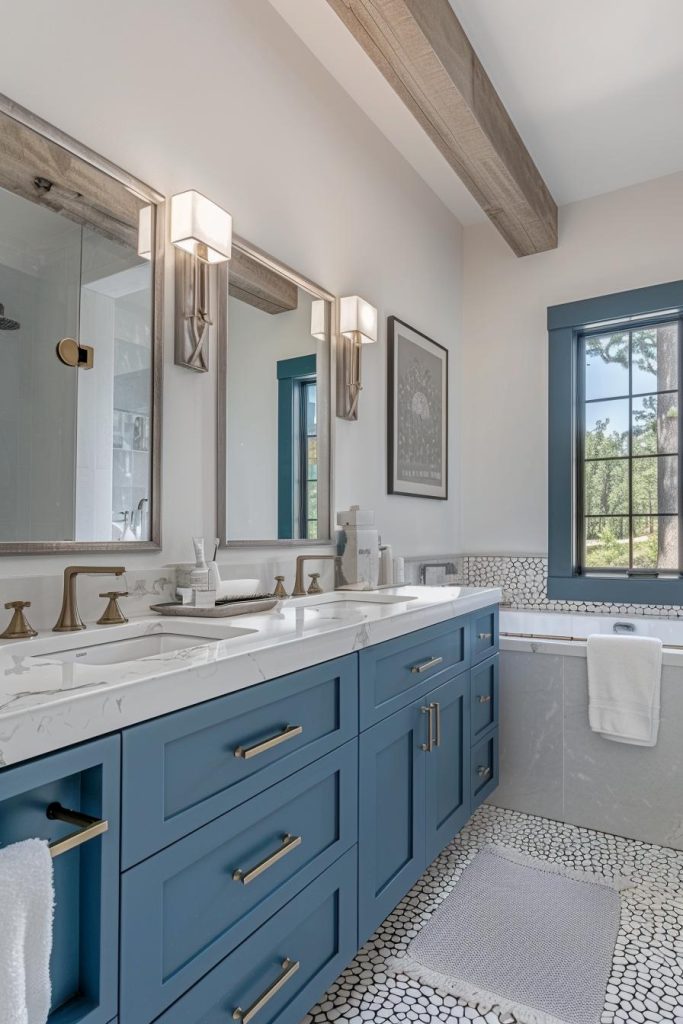 Sophisticated blue cabinets provide a stately base, while white counter fixtures reflect the foamy white of the ocean waves.