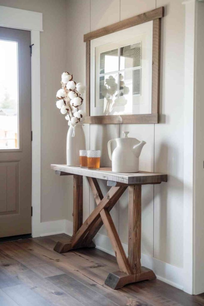 On this farmhouse entry table, that hospitality is highlighted with pitchers of sweet tea and cotton stems for a gentle, down-to-earth touch.