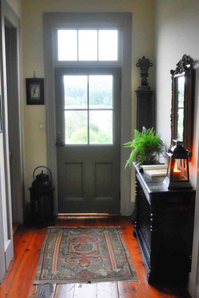 Add a touch of nostalgia to your space with a lantern and open picture book adorning the farmhouse entry table and an <a href=