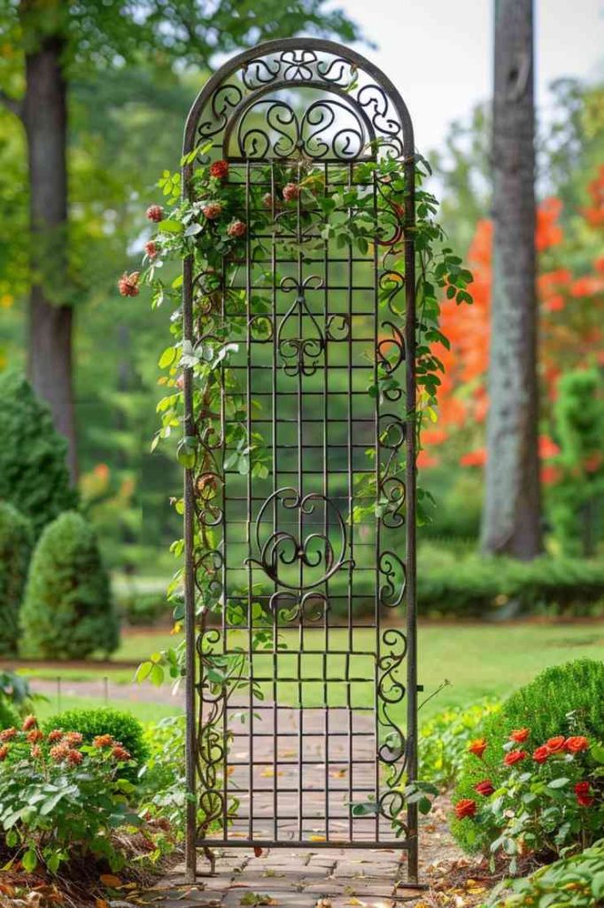 This wrought iron grille with its intricate scrollwork exudes a sense of enduring beauty. It is a strong and stately presence in any garden, inviting ivy and roses to weave through its ornamental design, creating a vibrant tapestry.