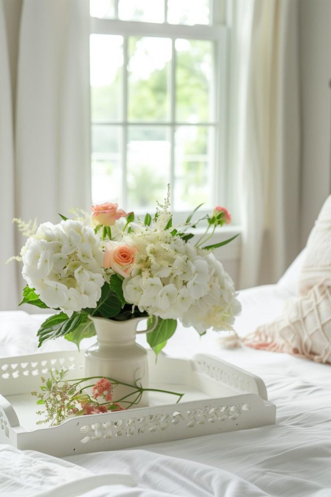 A feminine tray decorated with fresh flowers adds a gentle touch of nature to the soft decor of this bedroom. Not only does it look pretty, but it also adds a sweet refreshing scent to the room.