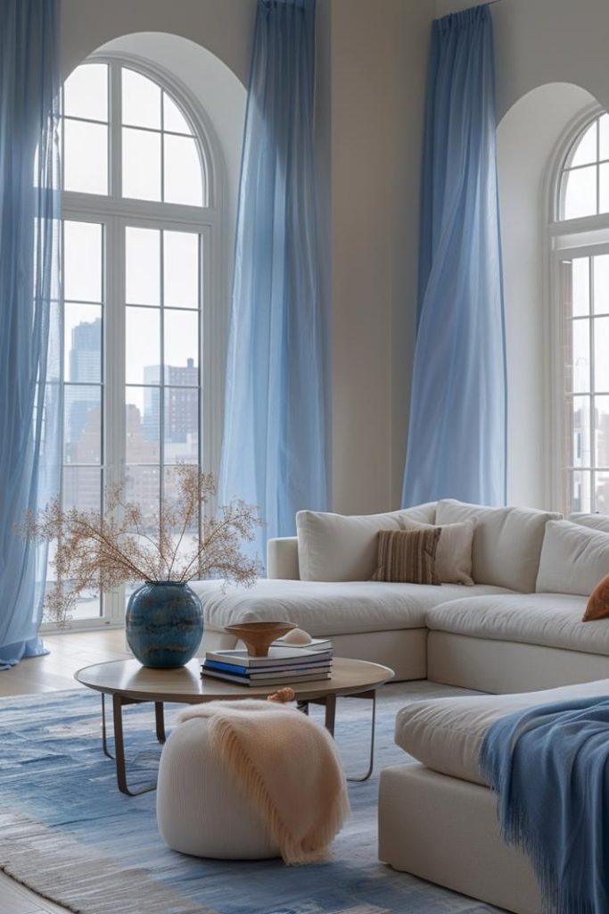 Sheer Azure curtains indicate the open sky, her airy movement is reminiscent of the gentle coastal wind.