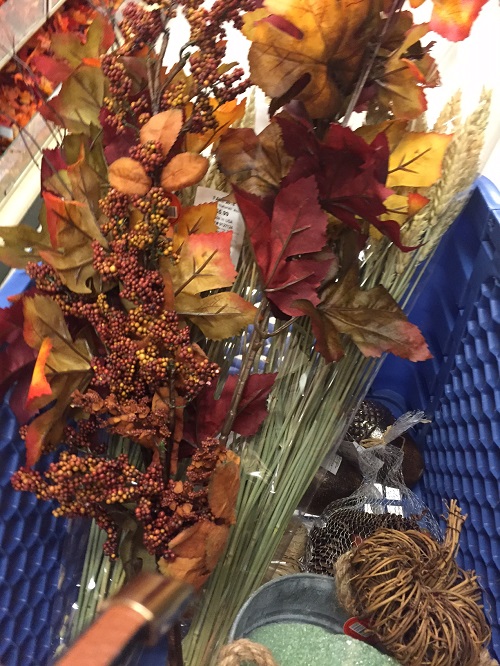 Shopping cart filled with fall decorations from Hobby Lobby