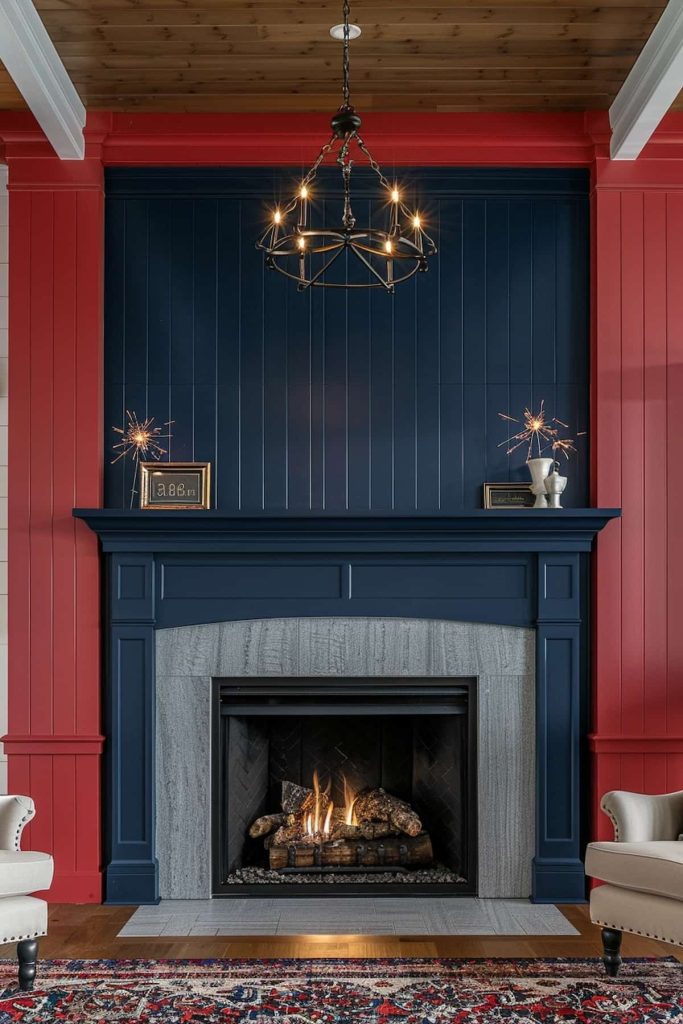 A living room has a fireplace with dark blue coat and red walls. The fireplace is illuminated and above, there is a chandelier with exposed onions. Decorative objects, including the Starburst ornaments and a framed photo, decorate the fireplace.