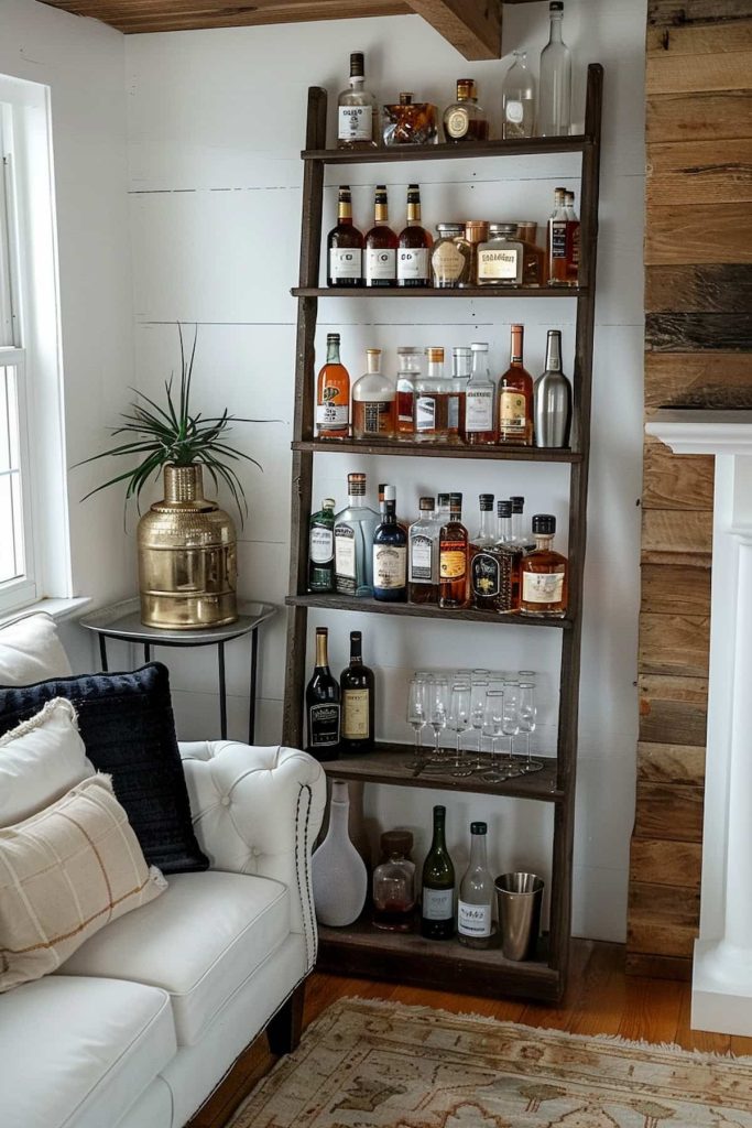 A high wooden load turns into a shelf with a selection of bottles, mainly alcohol, next to a white sofa with pillows. A decorative plant and a large golden vase sit on a small table next to the shelf.